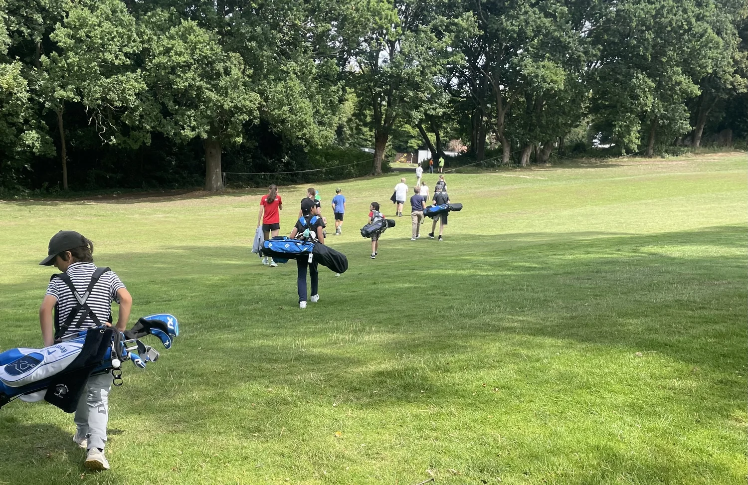 Junior golfers in a group coaching session
